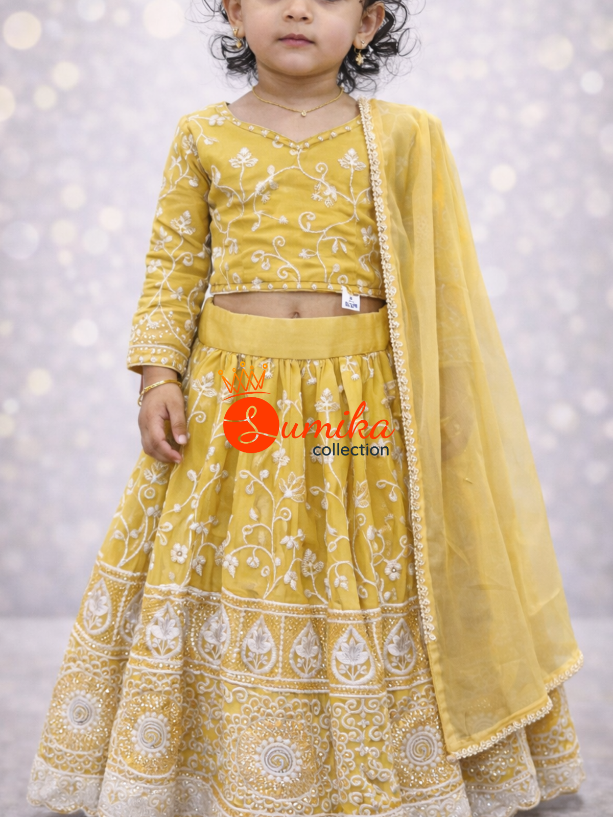 Golden yellow embroidered kids lehenga with dupatta and can-can flare from Sumika Collection USA